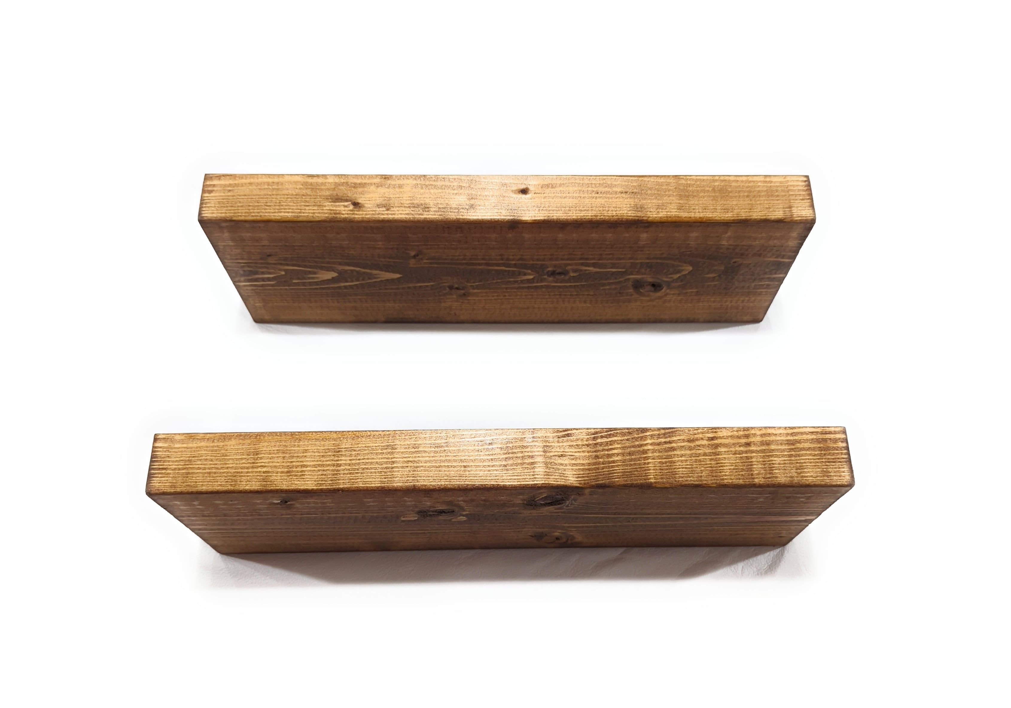 Two wooden shelves on a white background